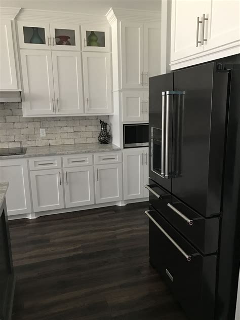 pictures of black stainless steel appliances with white cabinets|black and white kitchen cabinets.